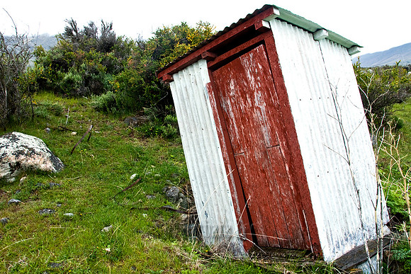 Tipped Outhouse